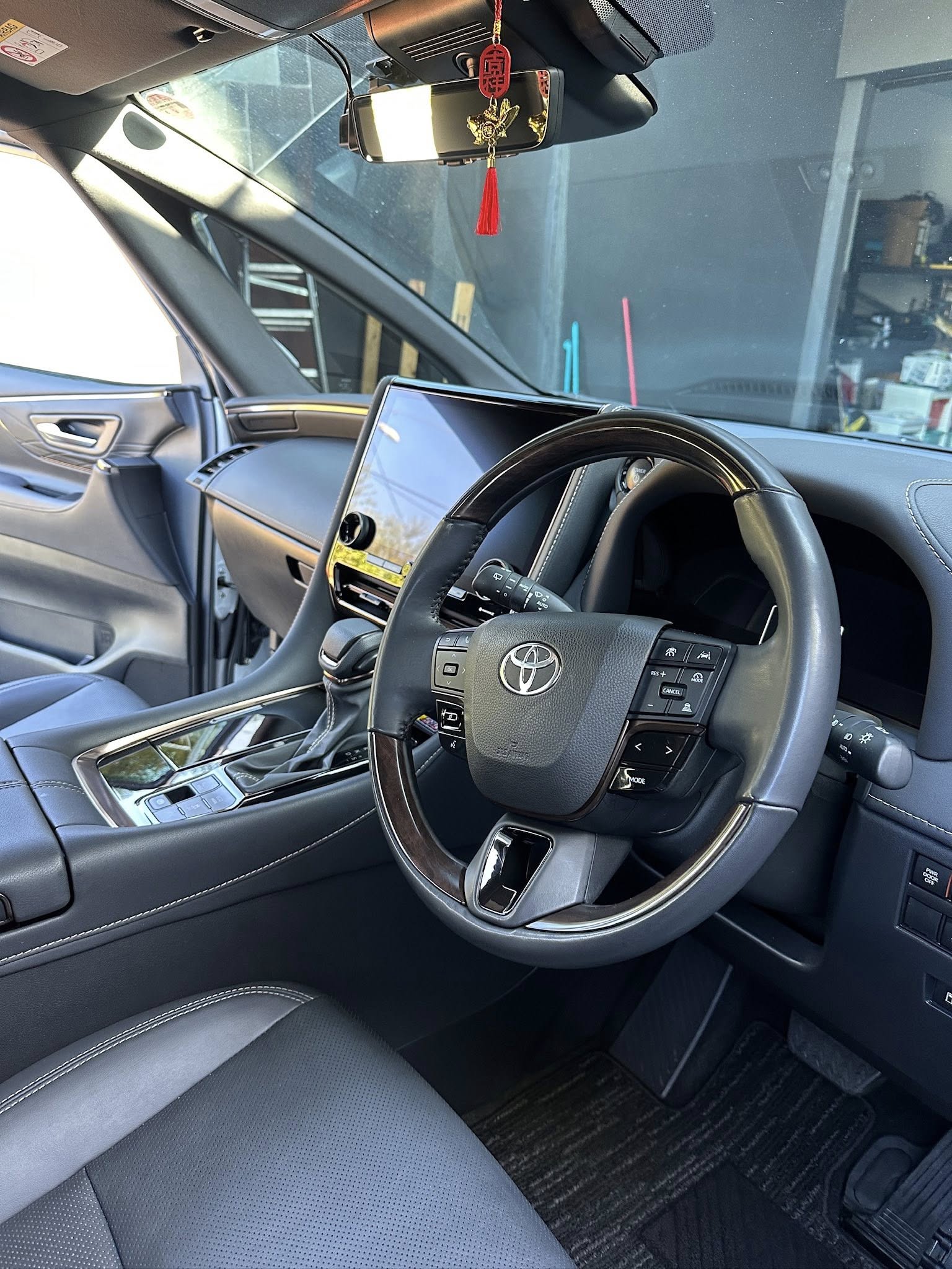 Toyota Alphard premium interior — steering wheel and cabin