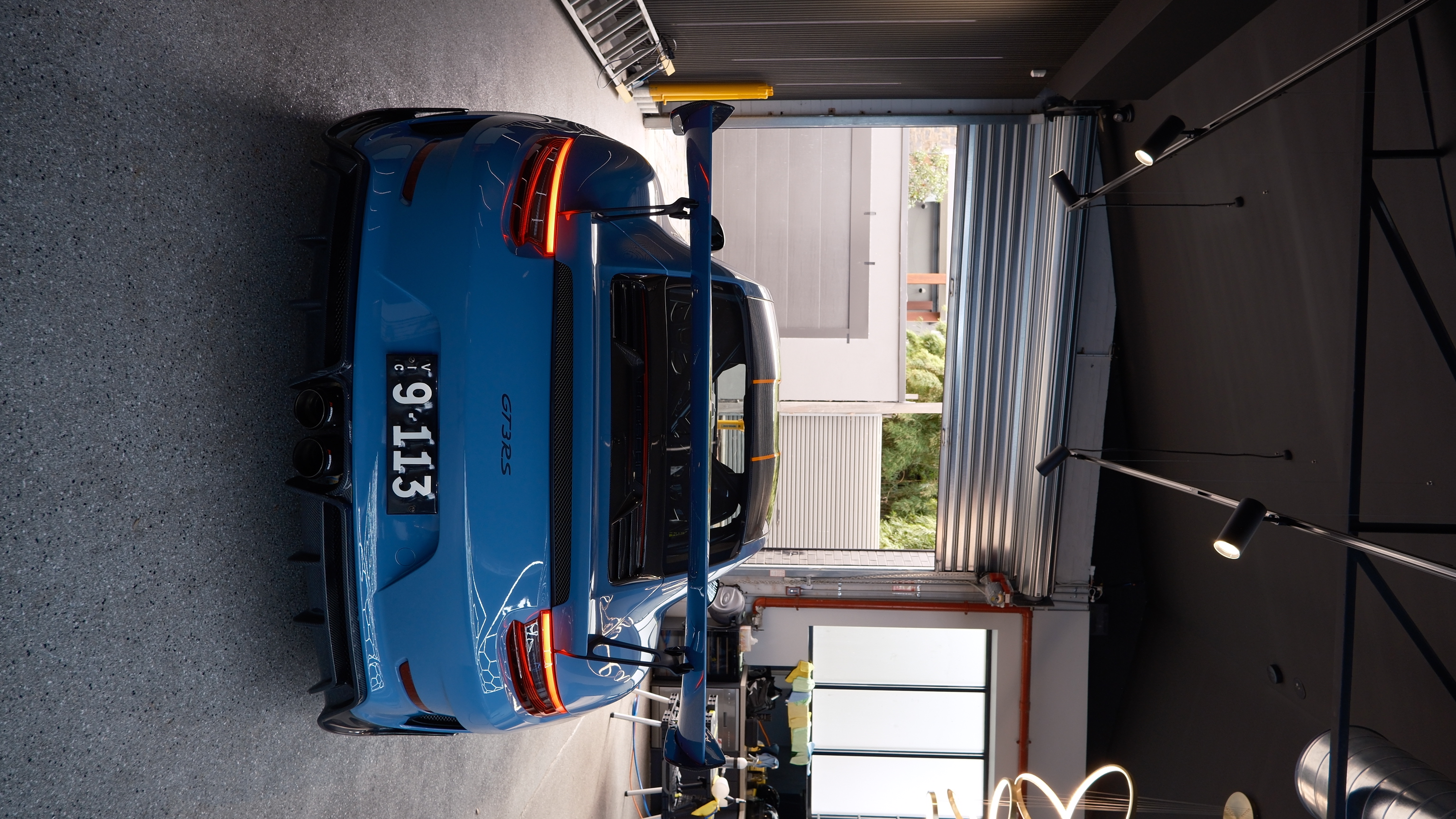 Porsche 911 GT3 RS rear wing in the detailing bay
