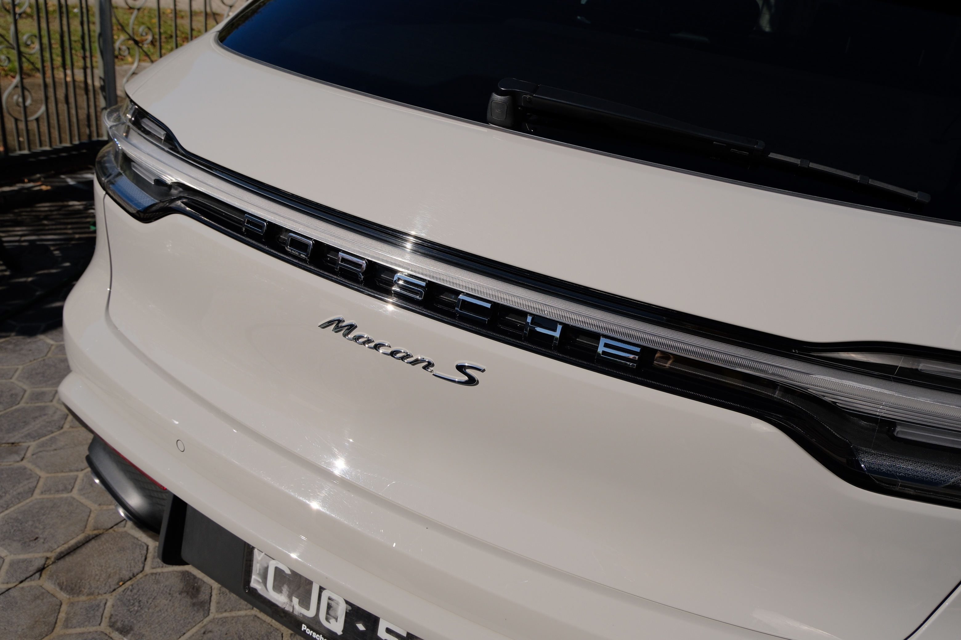 Porsche Macan S rear badge close-up after detailing
