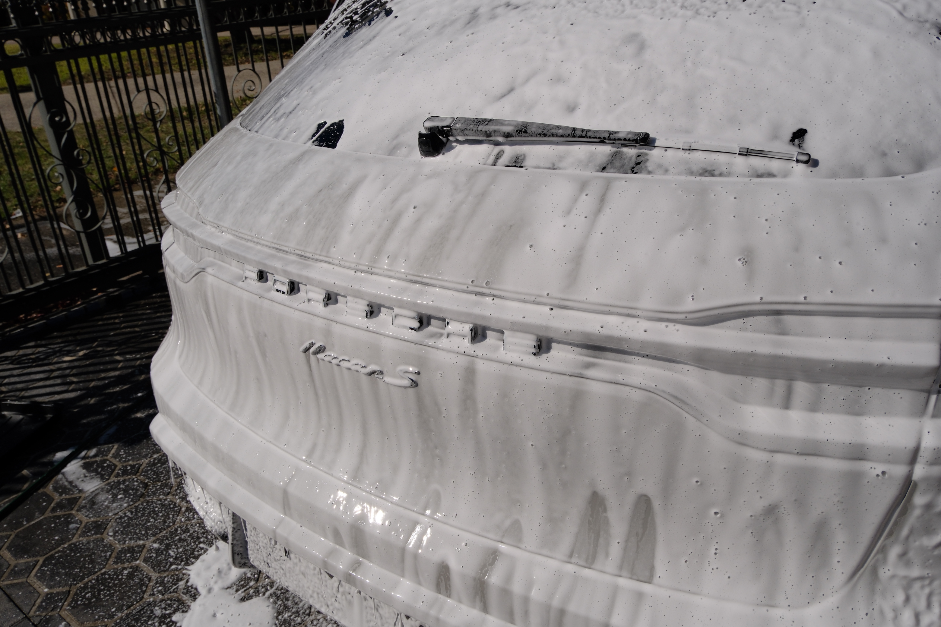 Porsche Macan S rear covered in snow foam pre-wash