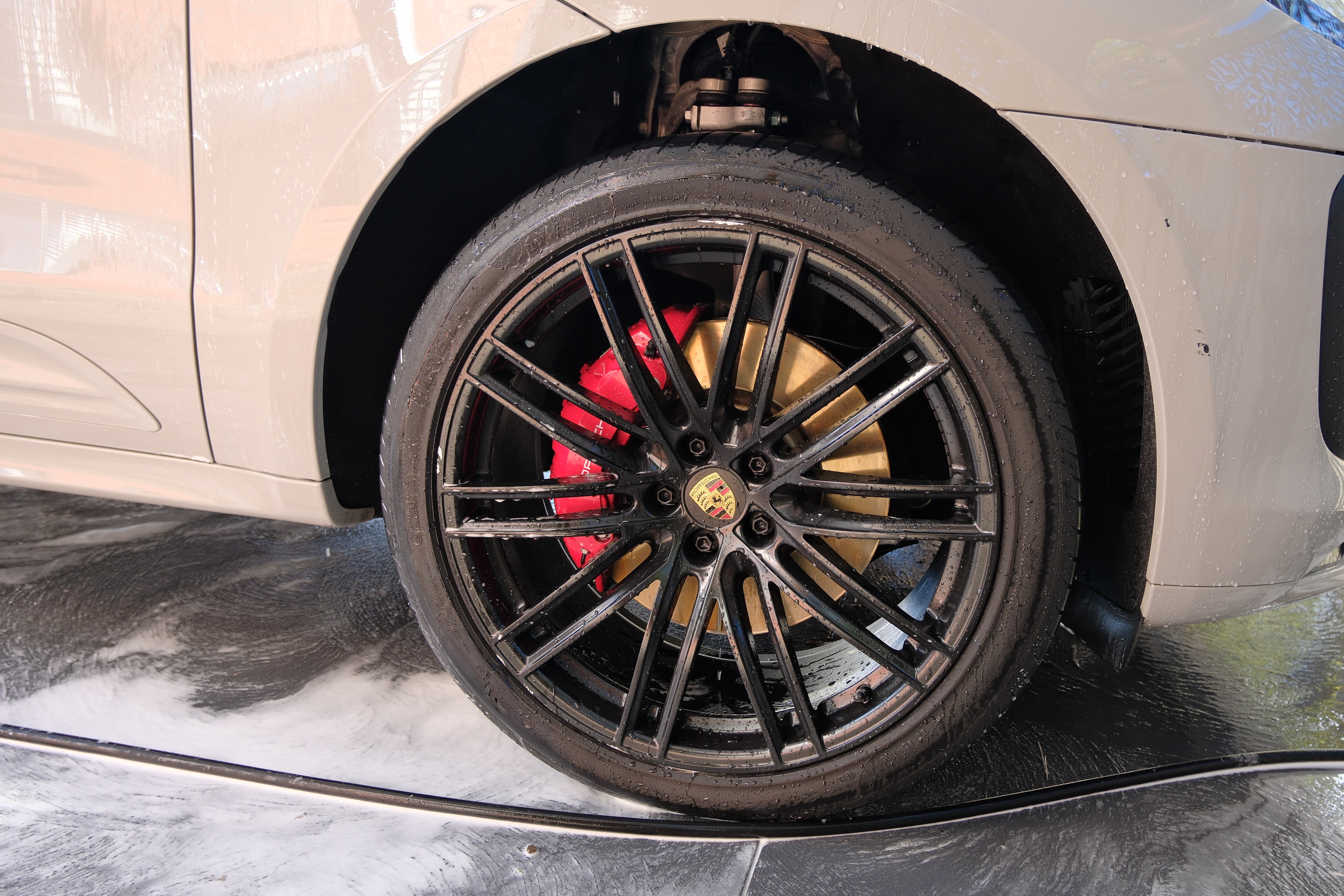 Porsche Macan S wheel with red brake caliper close-up